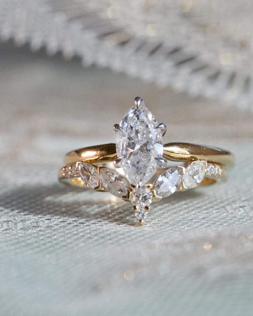 Custom Marquise Diamond Engagement Ring With Curved Diamond Band