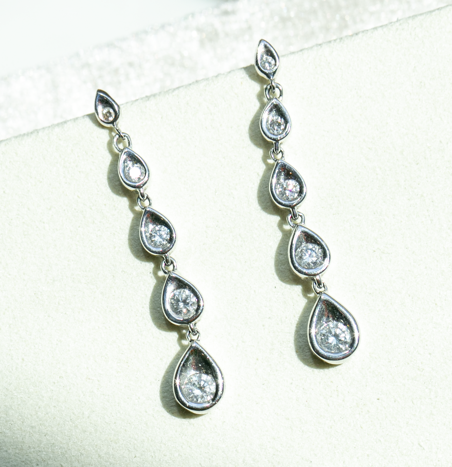 Contemporary Graduated Pear Motif Diamond Earrings in 14kt White Gold